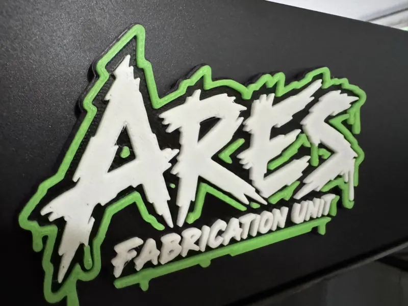 ARES Fabrication Unit sign with the lights on